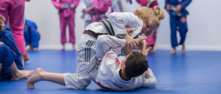 Child practising their guard passing at Gracie Barra Arnold